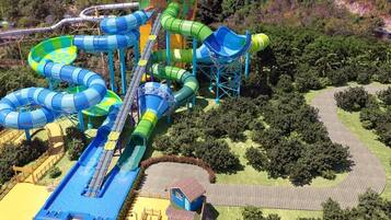 A water park with multiple slides and a long water slide.