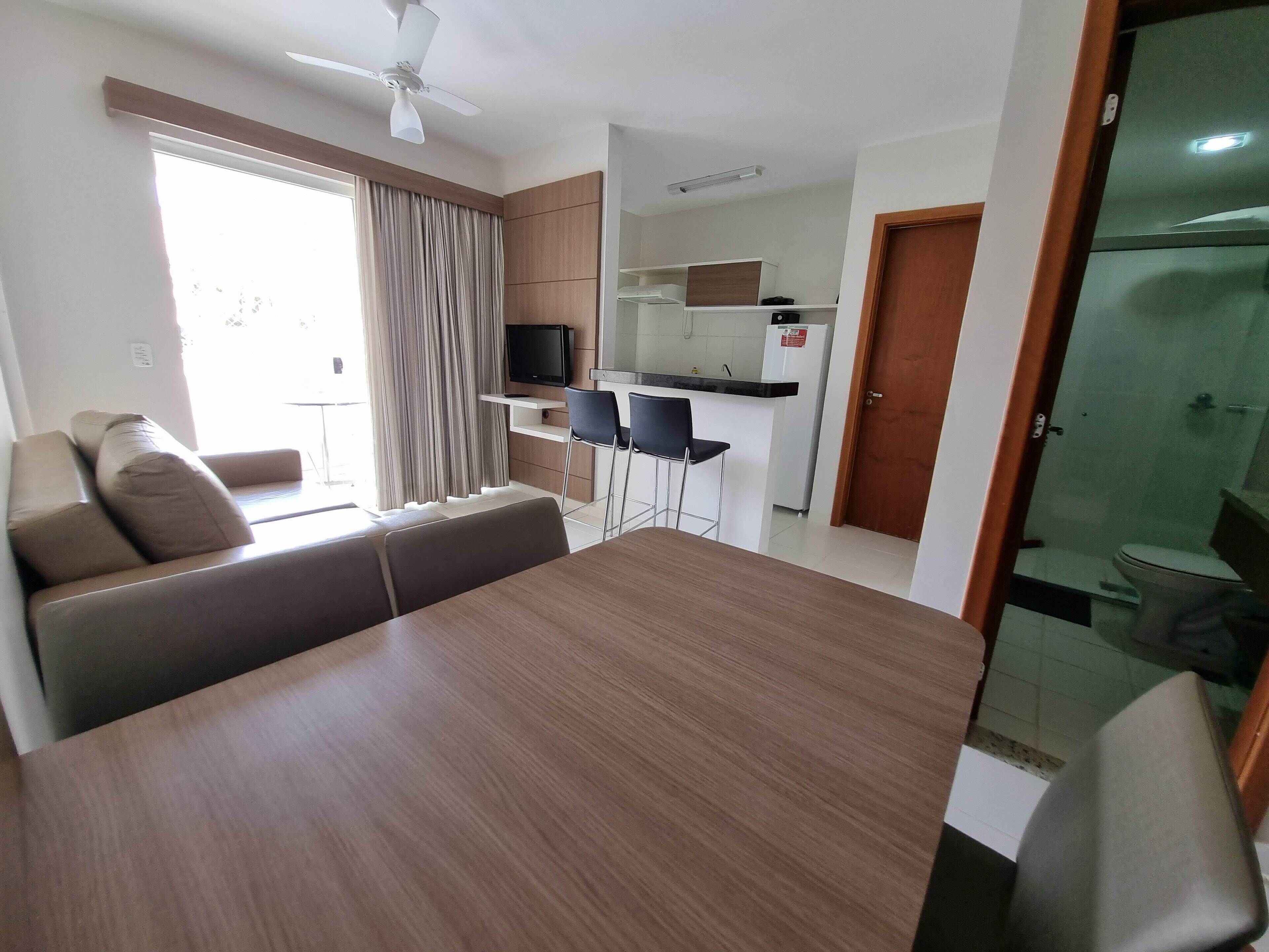 Suíte standard, para não fumantes, cozinha americana | Sala de estar | TV LCD 32 polegadas com canais a cabo, pebolim, mesa de pingue-pongue