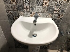 Shower, towels, soap, toilet paper