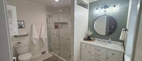 Shower, hair dryer, towels, soap
