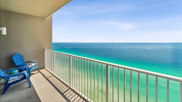 A balcony with a view of the ocean. - Snowbirds Land on the 29th Floor for the Winter (Panama City Beach)