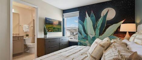 A bedroom with a bed, a night sky mural, a ceiling fan, and a window with blinds.