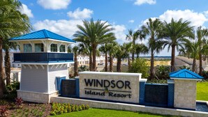 A sign for Windsor Island Resort with a blue-roofed building and palm trees. - Unrivaled Amenities Unforgettable Comfort Await (Davenport)