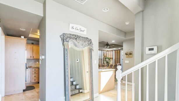 A modern home interior with a kitchen, dining area, and a staircase. - Beautiful Sunsets at 3BR Villa in Reno (Reno)