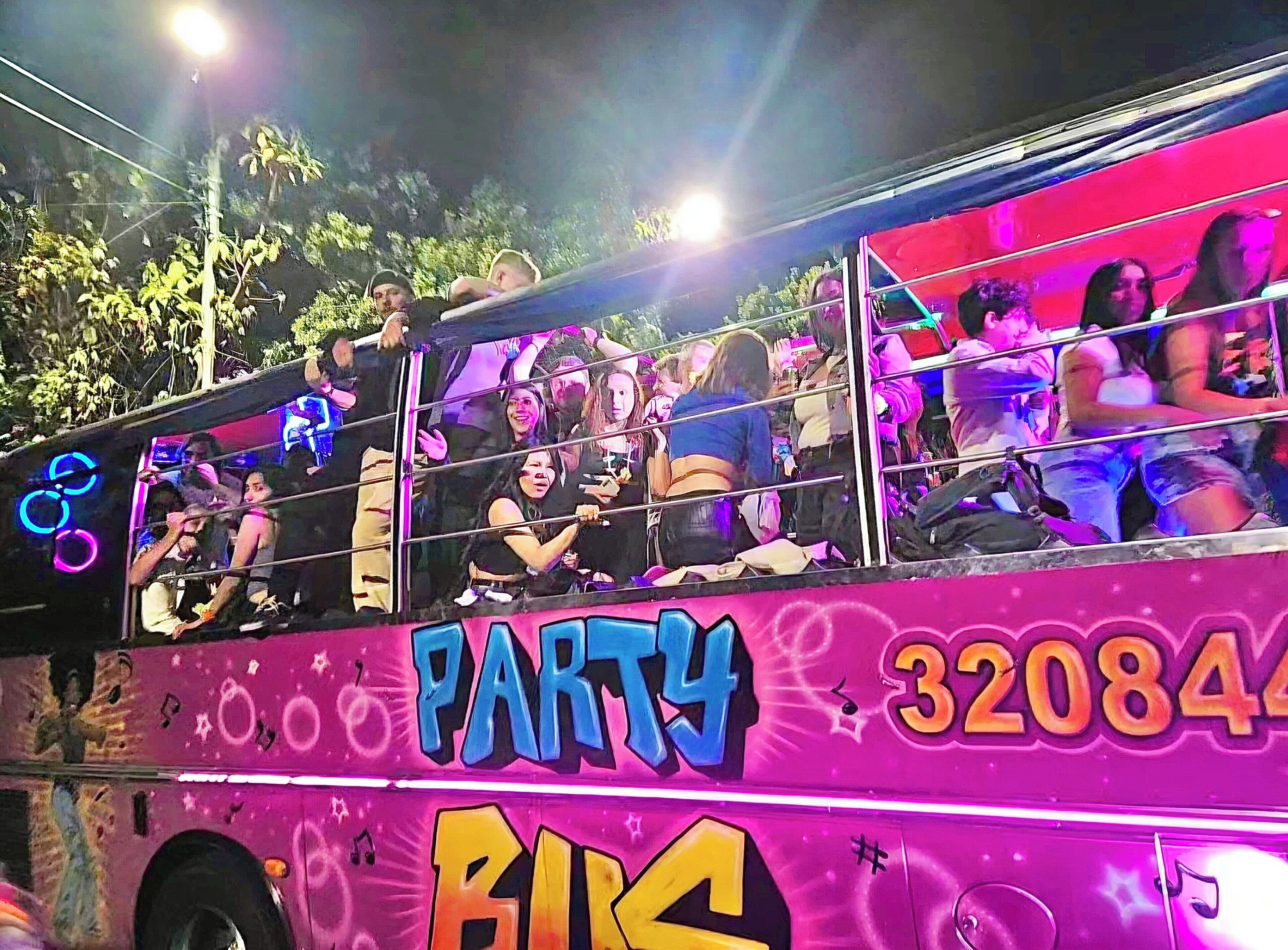 A double-decker bus with "PARTY" and "BIR" written on it, and the number "320844".