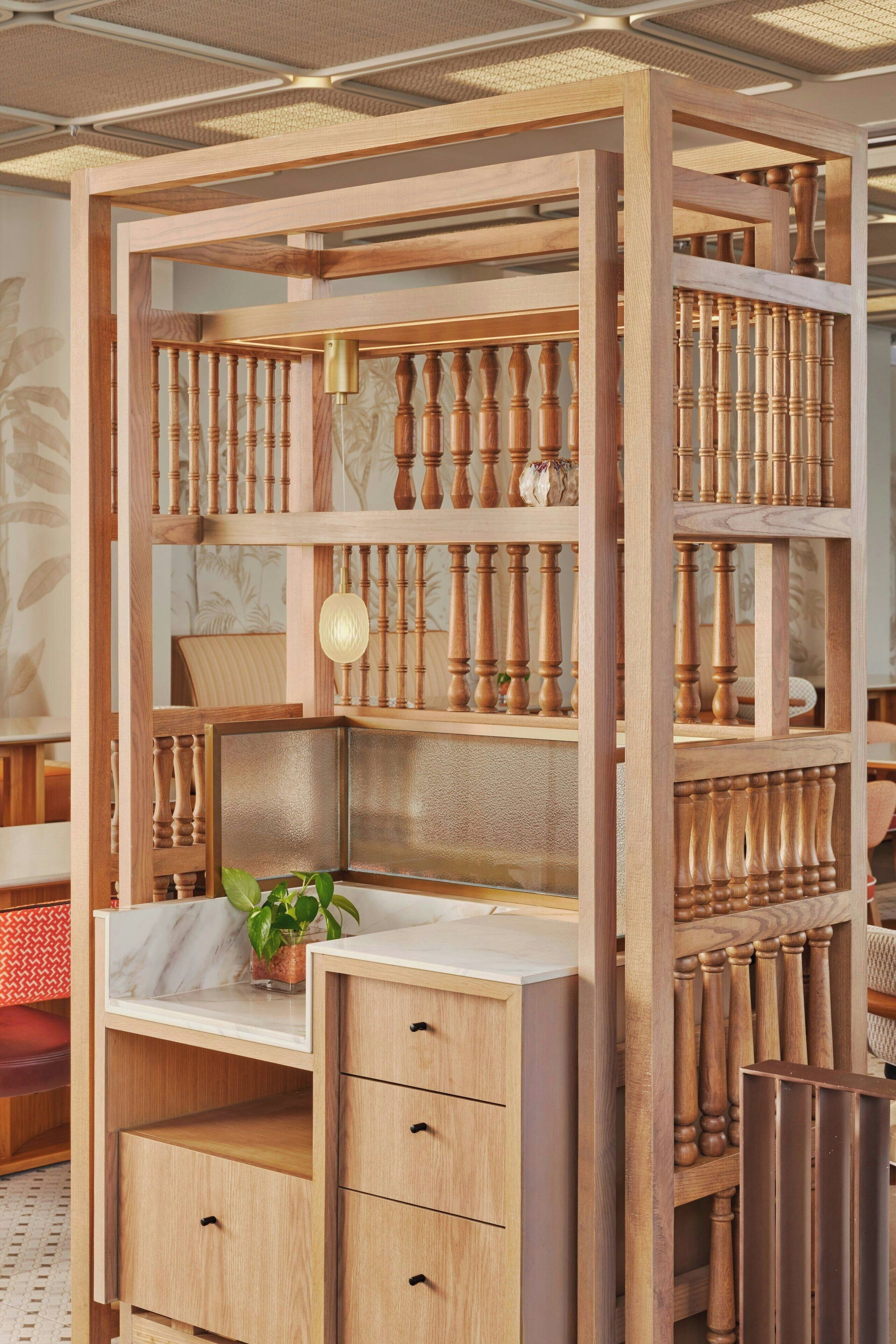 A wooden bookshelf with multiple compartments, including drawers and shelves.