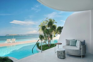 A modern balcony with a pool, a sofa, and a small table. - Veranda Resort Phuket, Autograph Collection (Wichit)