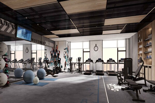 A modern gym with treadmills, elliptical machines, and free weights. - Four Points by Sheraton Yancheng, Jianhu (Yancheng)