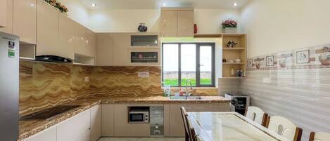 Full-size fridge, microwave, stovetop, rice cooker