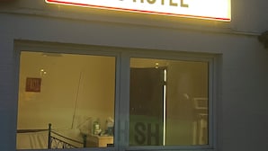 A hotel sign with the name "HS HOTEL" above a window. - HS Hotel (Hamburg)