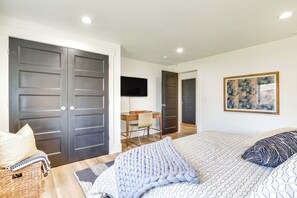 A bedroom with a bed, a desk, a chair, and a TV. - Private Pool & Hot Tub: Luxe Unit Near UTA Train! (American Fork)