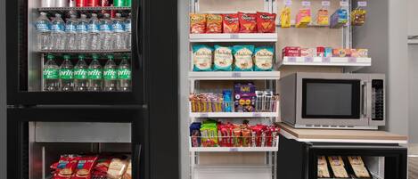 A vending machine stocked with various snacks and drinks, including sodas, chips, and cookies.