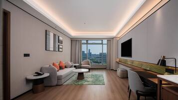 Suite Deluxe, 1 cama King size | Edredón, camas con pillow-top y artículos del minibar gratis