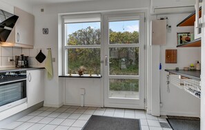 Fridge, stovetop, dishwasher, coffee/tea maker