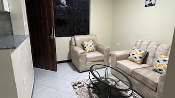Suite, Balcony, City View | Living area | 40-inch Smart TV with digital channels