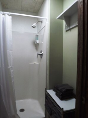 Shower, towels, soap, toilet paper