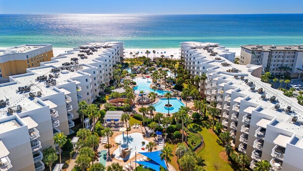 A resort with multiple buildings, a central pool area, and a view of the ocean. - Waterscape B105 ~ 2BR Ground Floor ~ Gulf Views! (Fort Walton Beach)
