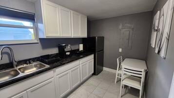 Fridge, microwave, coffee/tea maker, toaster