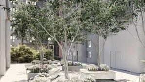 A modern courtyard with planters and trees. - 2 BR Fully Furnished Condo Parañaque with Pool and Parking - Bloom 1133 (Parañaque)