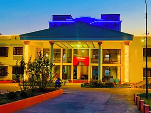A building with a red sign reading "Moorimgai Residency" and a covered entrance with columns. - Mookambigai residency (Tarangambadi)