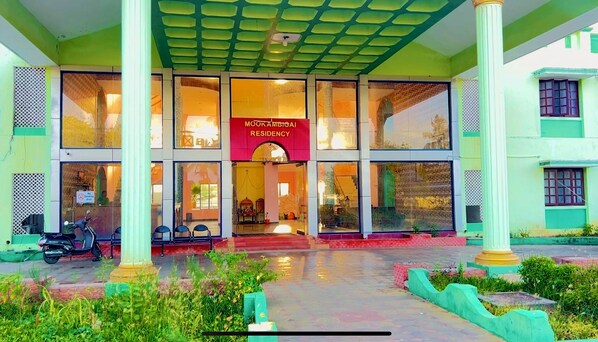 A building with a sign reading "MUKAMBIGAJ RESIDENCY". - Mookambigai residency (Tarangambadi)