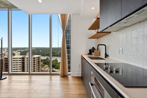 Microwave, oven, stovetop, dishwasher - Luxury Lake View Corner Condo (Austin)