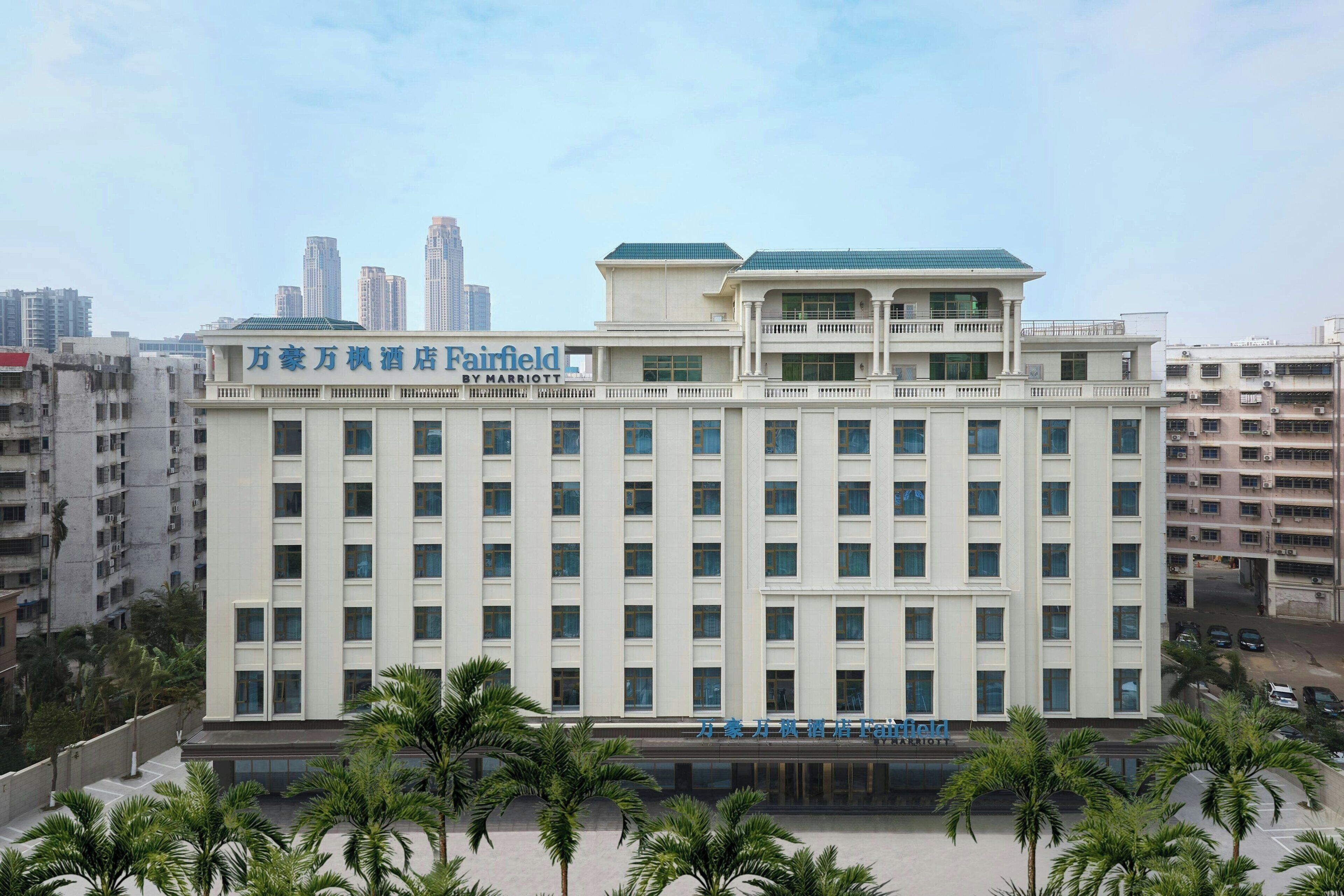 A multi-story hotel with a sign indicating it is a Marriott property.