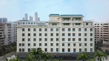 A multi-story hotel with a sign indicating it is a Marriott property.