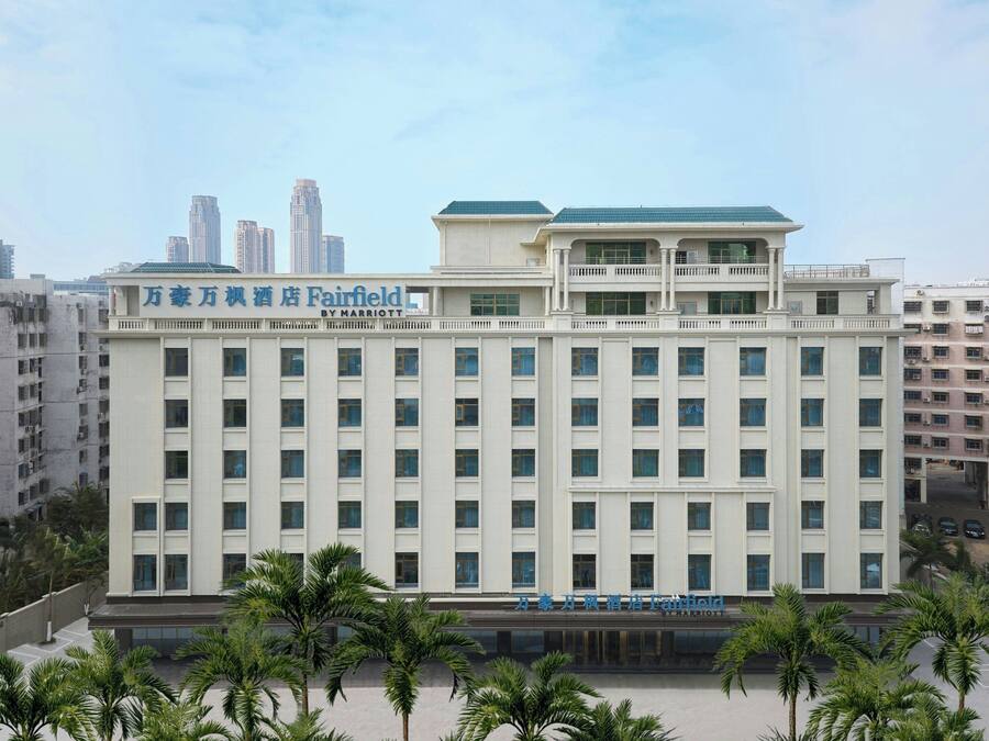 A multi-story hotel with a sign indicating it is a Marriott property.