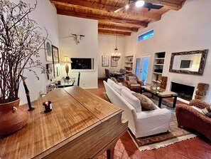 TV, fireplace, books
