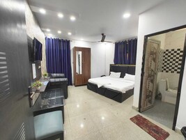 Desk, laptop workspace, blackout curtains, free WiFi