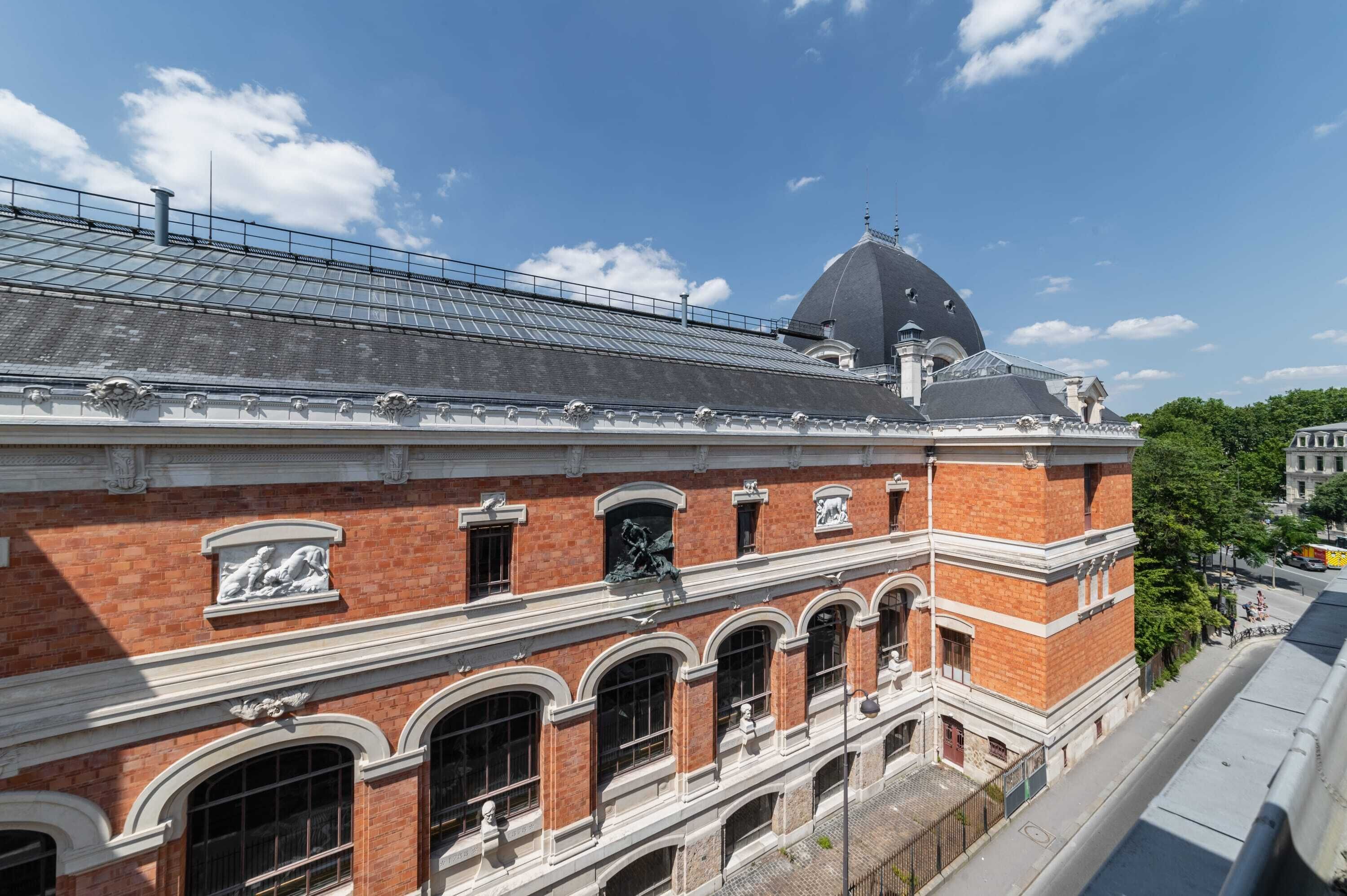 A historic building with a prominent dome and arched windows.