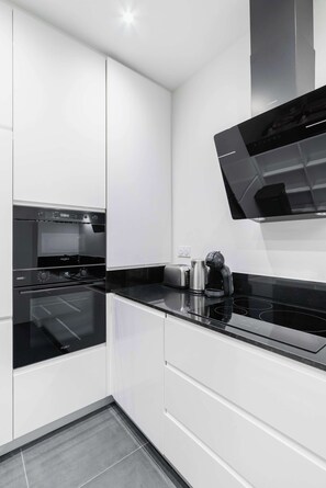 Fridge, microwave, stovetop, coffee/tea maker