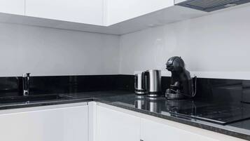 Fridge, microwave, stovetop, coffee/tea maker