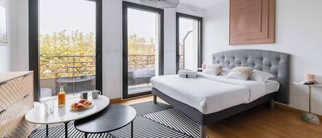 Desk, iron/ironing board, bed sheets