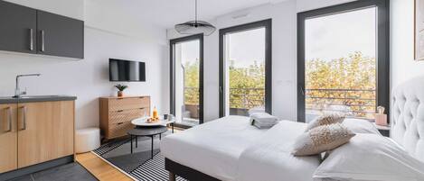 Desk, iron/ironing board, bed sheets