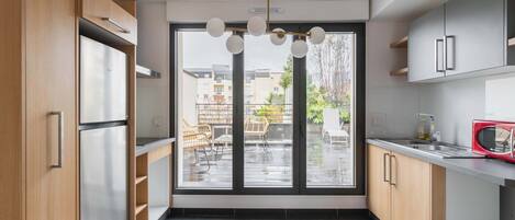 Fridge, microwave, stovetop, coffee/tea maker