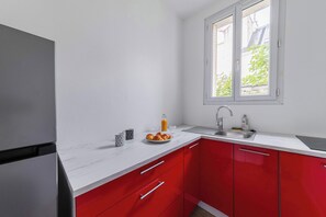 Fridge, microwave, stovetop, coffee/tea maker