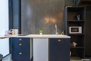 Fridge, microwave, stovetop, coffee/tea maker