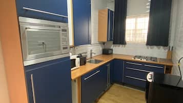 Deluxe Apartment, Kitchen | Private kitchen