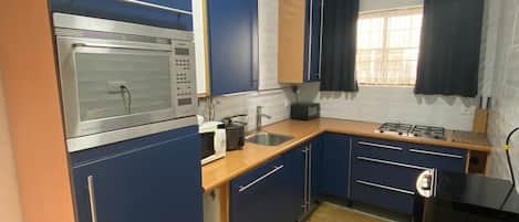 Deluxe Apartment, Kitchen | Private kitchen