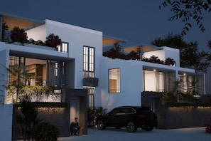 A modern two-story house with a car parked in the driveway. - BrandNew Luxury Villa Nyanyi 3 (Tabanan)