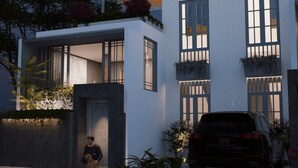 A modern two-story house with large windows, a visible garage, and a dog sitting outside. - BrandNew Luxury Villa Nyanyi 3 (Tabanan)