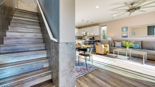 A modern interior with a staircase, a dining area, and a living room with a sofa and coffee table. - Casa do Sol by AvantStay | Rooftop Deck w/ Ocean Views | 2 blocks to Beach! (Pismo Beach)