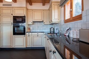 Coffee/tea maker, fridge, microwave, oven