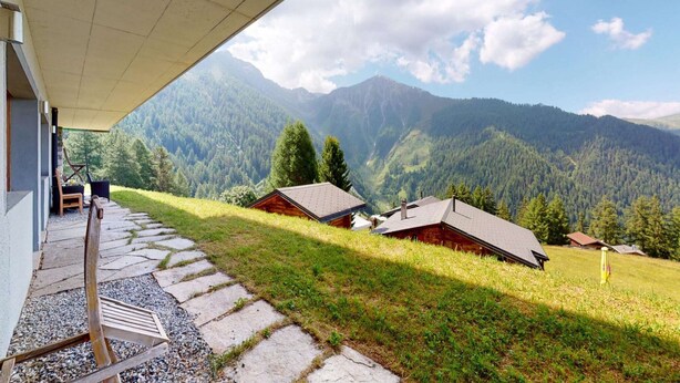 A mountain cabin with a stone pathway leading to a wooden bench. - Apartment in Nendaz on ski slopes (Haute-Nendaz)