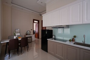 Family Suite, Park View | Private kitchen | Electric kettle, dining tables - The One Da Lat Hotel (Da Lat)