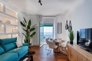 Basic Apartment, Balcony | Living area | 35-cm TV with digital channels