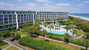 A hotel with multiple floors, a pool area, and a beach view. - Oceanfront w/ Lazy River! Rare floorplan, Nicely Furnished, 2BRs-Bridgewater 507 (Pawleys Island)