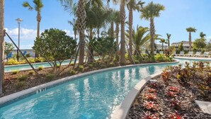 A pool area with palm trees and lounge chairs. - 16231 Fantastic Family Home For The Perfect Stay (Clermont)